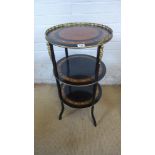 An ebonised burr walnut three tier etergere with ormolu fittings - Height 77cm x Diameter 38cm