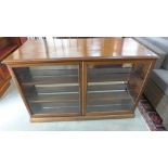 A Victorian style mahogany shop counter with shallow two door display to front and cupboards to