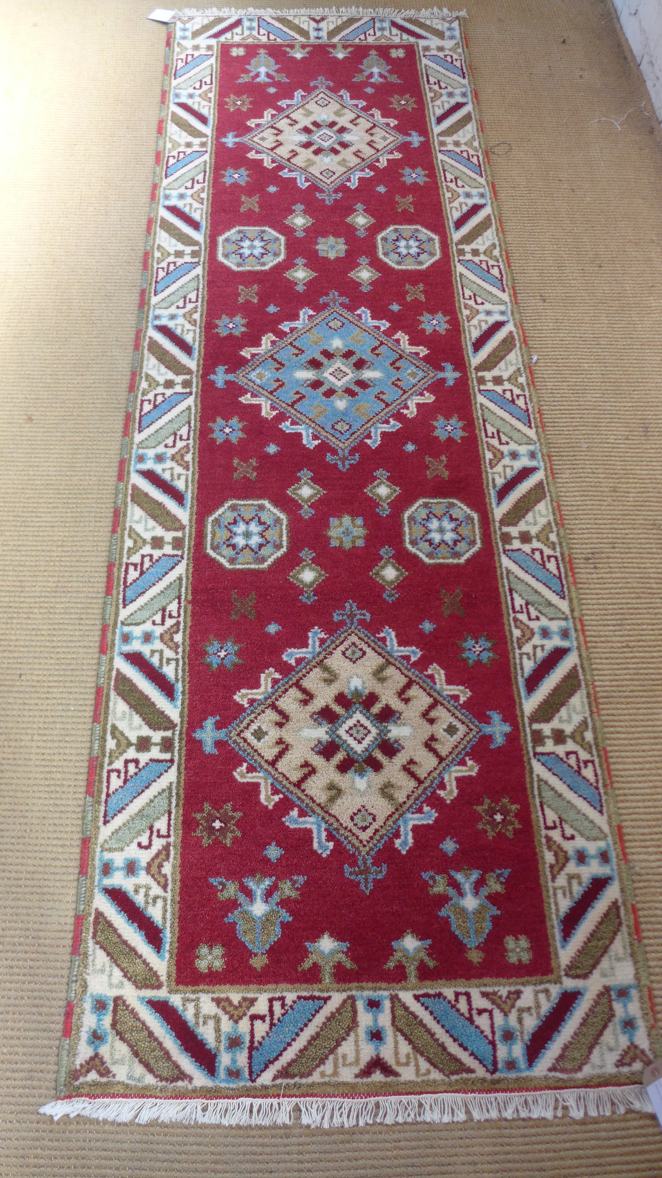 A Kazak 100% wool hand knotted rug - 250cm x 82cm