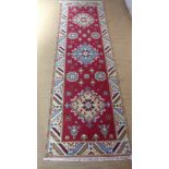 A Kazak 100% wool hand knotted rug - 250cm x 82cm