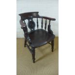 A 19th century target back smokers bow armchair