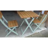 A folding painted garden bistro table table and chairs