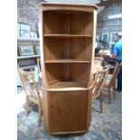 An Ercol Elm corner cupboard - in good condition