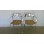 A pair of aluminium chairs with wicker seats by Alutec - Height 76cm x Width 56cm x Depth 50cm -