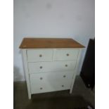 An off white painted five drawer chest - Height 100cm x Width 90cm x Depth 46cm - narrow expansion