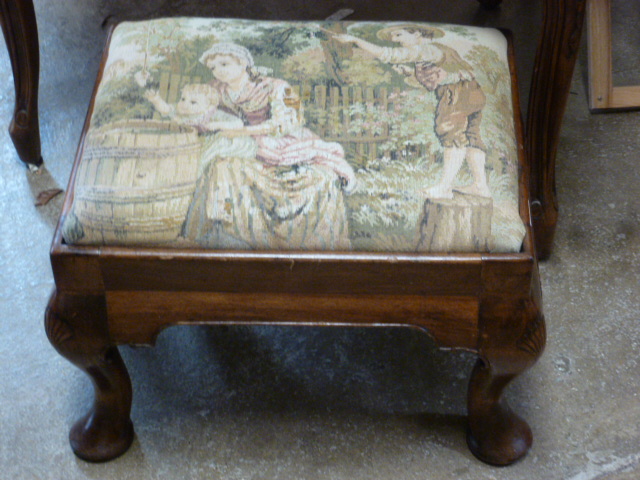 A walnut stool on dwarf cabriole legs in good condition