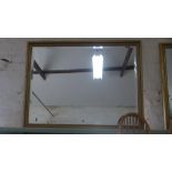 A large modern gilt framed rectangular bevelled mirror - 129cm x 97cm