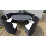 A second hand Bramblecrest aluminium 180cm table and four woven benches with cushions as new