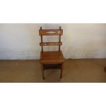 A 19th century oak Arts and Crafts metamorphic library chair/steps