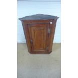 A Georgian fruit wood corner cupboard with panelled door - Height 87cm x Width 67cm