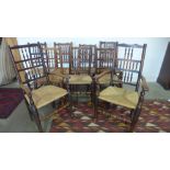 A Harlequin set of nine 19th century ash and elm bobbin back kitchen chairs with rush seats