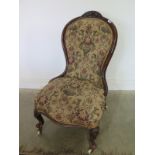 A Victorian walnut framed ladies chair