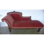 A Victorian walnut button back chaise lounge on turned legs