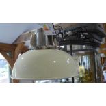 A new Culinary Concepts hanging industrial style light fitting in chrome with a cream shade -