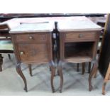 A pair of late 19th century French walnut bedside cabinets on cabriole legs,