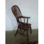 A 19th century yew wood stick back armchair with bobbin turned supports and pierced splat