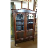 A 19th century walnut Biedermeir display cabinet with two glazed doors above a drawer - Height