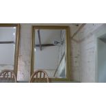 A modern gilt framed rectangular bevelled mirror - 66cm x 96cm