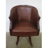 An Edwardian mahogany swivel desk chair