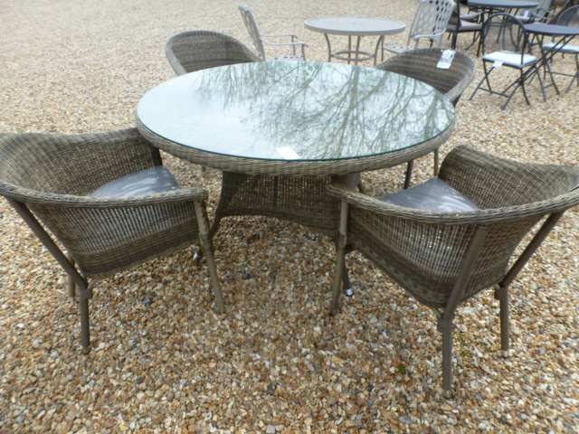 A Bramblecrest circular table with four stacking armchairs with cushions - Diameter 140cm