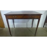 A 19th century mahogany writing table with a leather inset top over two drawers on square tapering