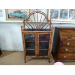 A Victorian bamboo and lacquer two door glazed bookcase with raised bamboo gallery - total height