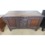 A late 18th century three panel oak coffer,