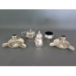 A three piece silver condiment set,