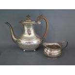 A silver coffee pot London 1896/97 Edward Barnard and Sons Ltd with an associated silver milk jug -