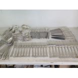 An extensive set of silver Kings pattern flatware including dinner spoons, 13 side spoons, 3 ladles,