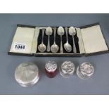 A boxed set of six silver coffee spoons,