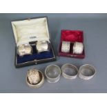 Two boxed sets of silver napkin rings and five loose silver napkin rings Condition report: All