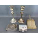 A pair of silver hallmarked candlesticks, a silver embossed top crumb brush,