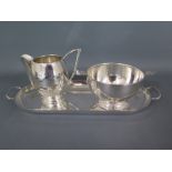 A small 20th century Dutch silver creamer and sugar bow and a small Dutch oblong silver tray -
