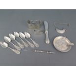 Six small Dutch silver coffee spoons, a small butter knife, a scarf and a napkin clip, a toothpick,