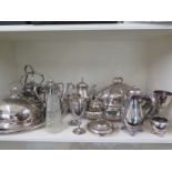 A quantity of silver plate including a claret jug, two meat covers, two trays,