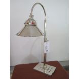 A nickel plated Art Deco style desk lamp on stepped oblong base