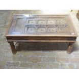 An Eastern wooden door coffee table with glass top - Height 45cm x 59cm x 106cm