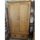 An ex display oak wardrobe with two doors and one base drawer - 190cm x 100cm - condition as new