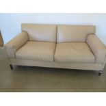 A cream leather sofa,