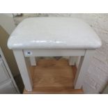 A dressing table stool