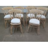 A set of six modern Windsor lined slat back kitchen chairs with cream seat pads