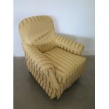 A Laura Ashley upholstered armchair with a stripped loose cover