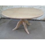 A circular lined oak dining table made by Turners Cabinet makers of Cambridge - Height 75cm x