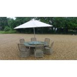 A Bramblecrest Sahara circular garden table - Diameter 180cm - with a lazy susan,