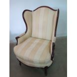 A Wesley Barrell mahogany framed upholstered armchair