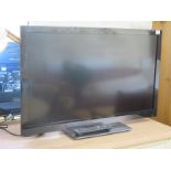 A Panasonic 37" flat screen TV with remote - model TX L37E30B - In working order