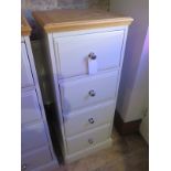 An ex display paneled four drawer tallboy - Height 108cm x Width 44cm x Depth 41cm