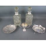 A pair of silver rimmed scent bottles,