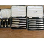 Two cased sets of silver handled knives and a boxed set of silver bean spoons - knife handles with